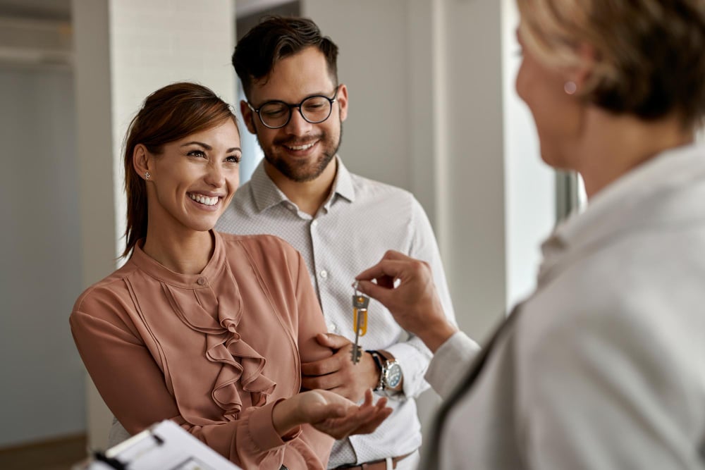 Tenants receiving keys from a landlord